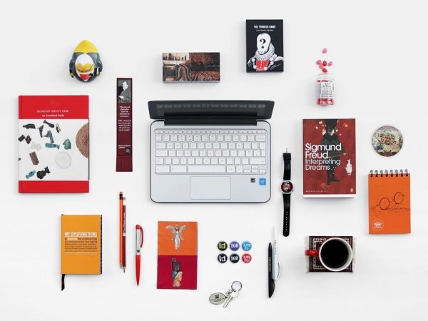 A selection of items from the Freud Museum shop, including books, stationery, badges, mugs and a wristwatch.