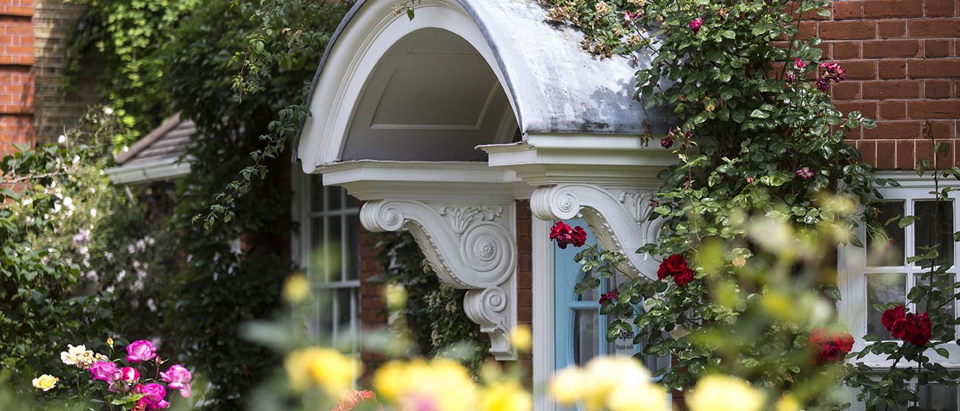 photograph of front door at Freud Museum surrounded by roses