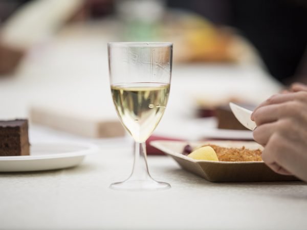 Functions & Dinners. Freud Museum London.photographing detailing someone eating a meal. central to the image is a wine glass