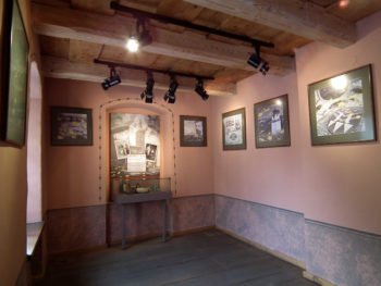 Interior of a room with framed prints on the walls.