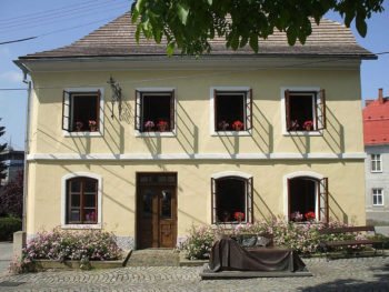 Colour photograph or a two-storey house.